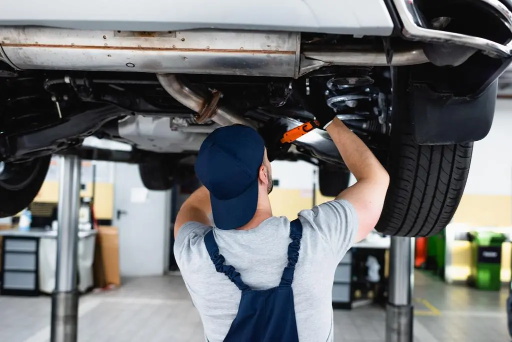 repairing car in service station